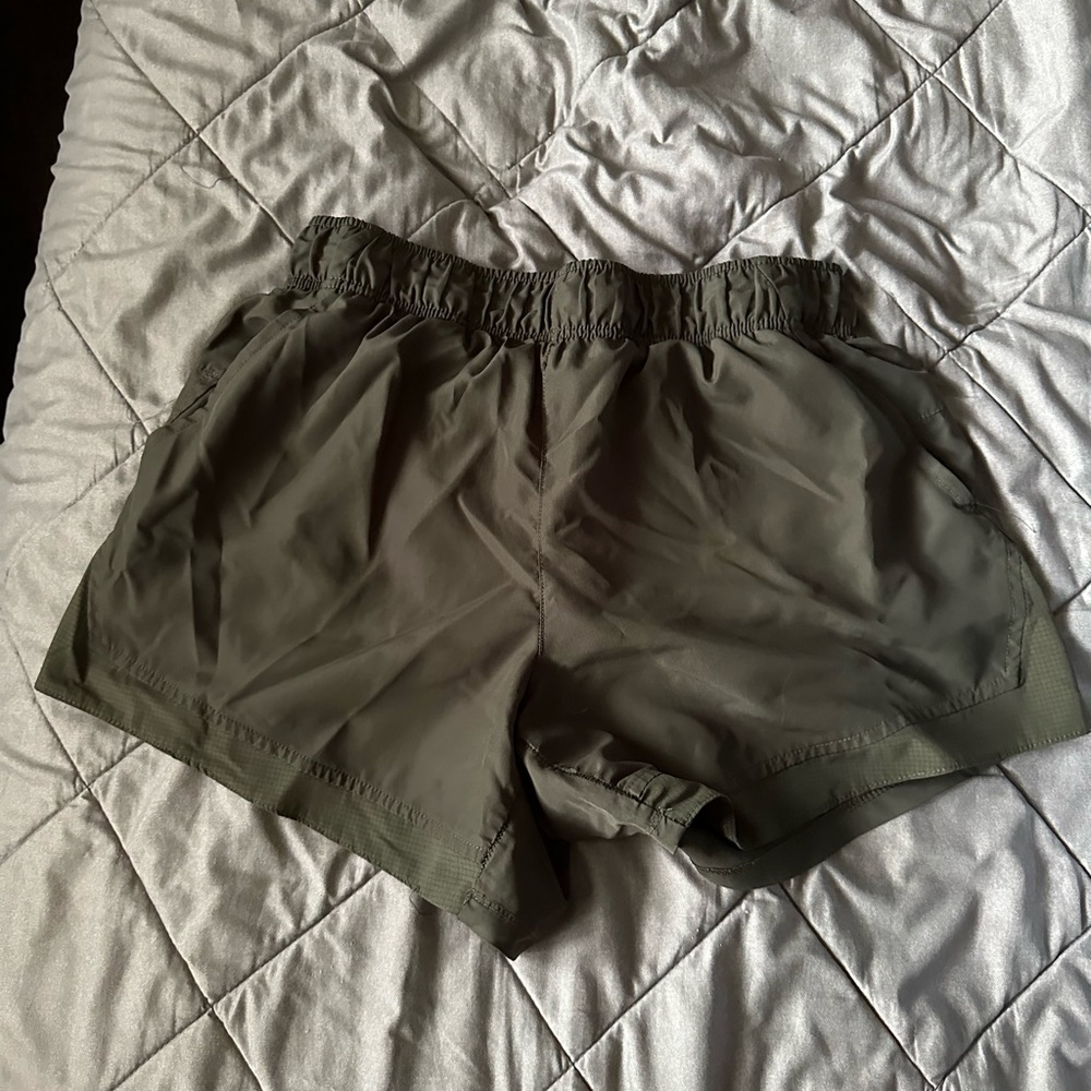 forest green athletic shorts, medium